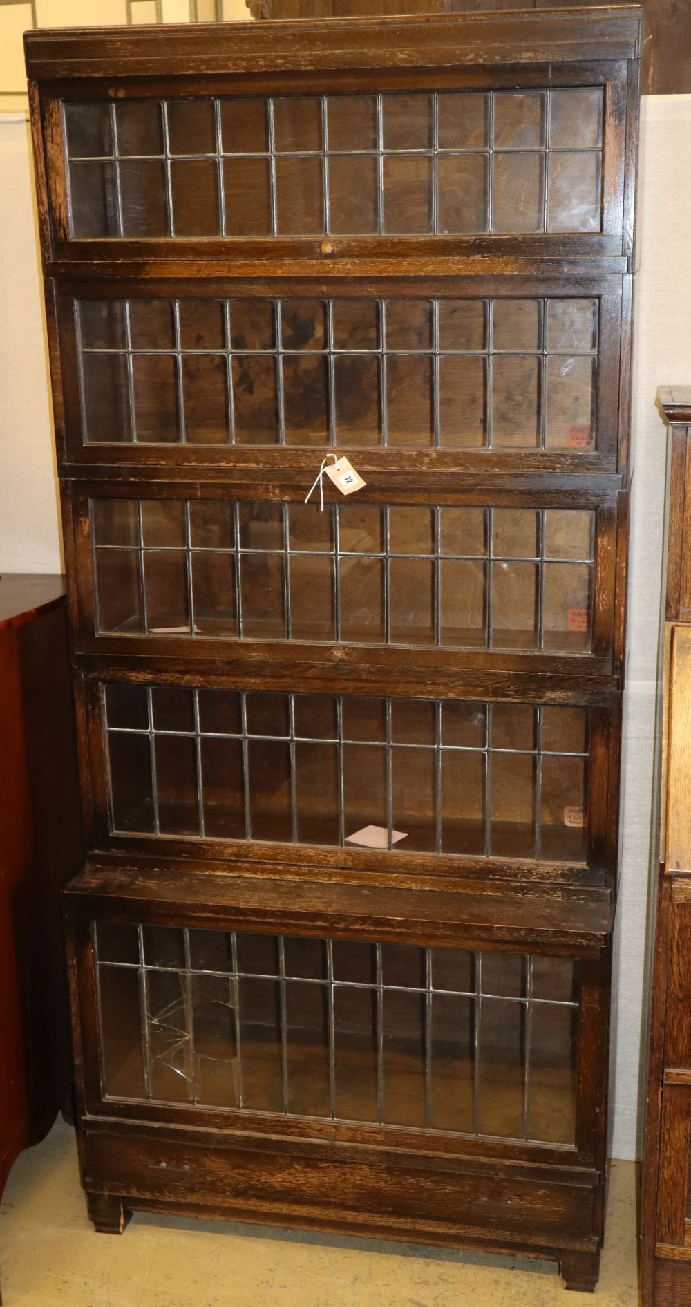 A five-section oak Globe Wernicke bookcase with leaded glass doors, W.85cm, D.34cm, H.188cm